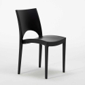 Musta neliöpöytä 70x70cm ja kaksi värikästä tuolia Paris Aia 